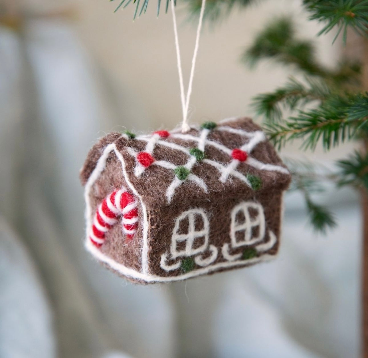 Big Gingerbread house with candy cane ornament