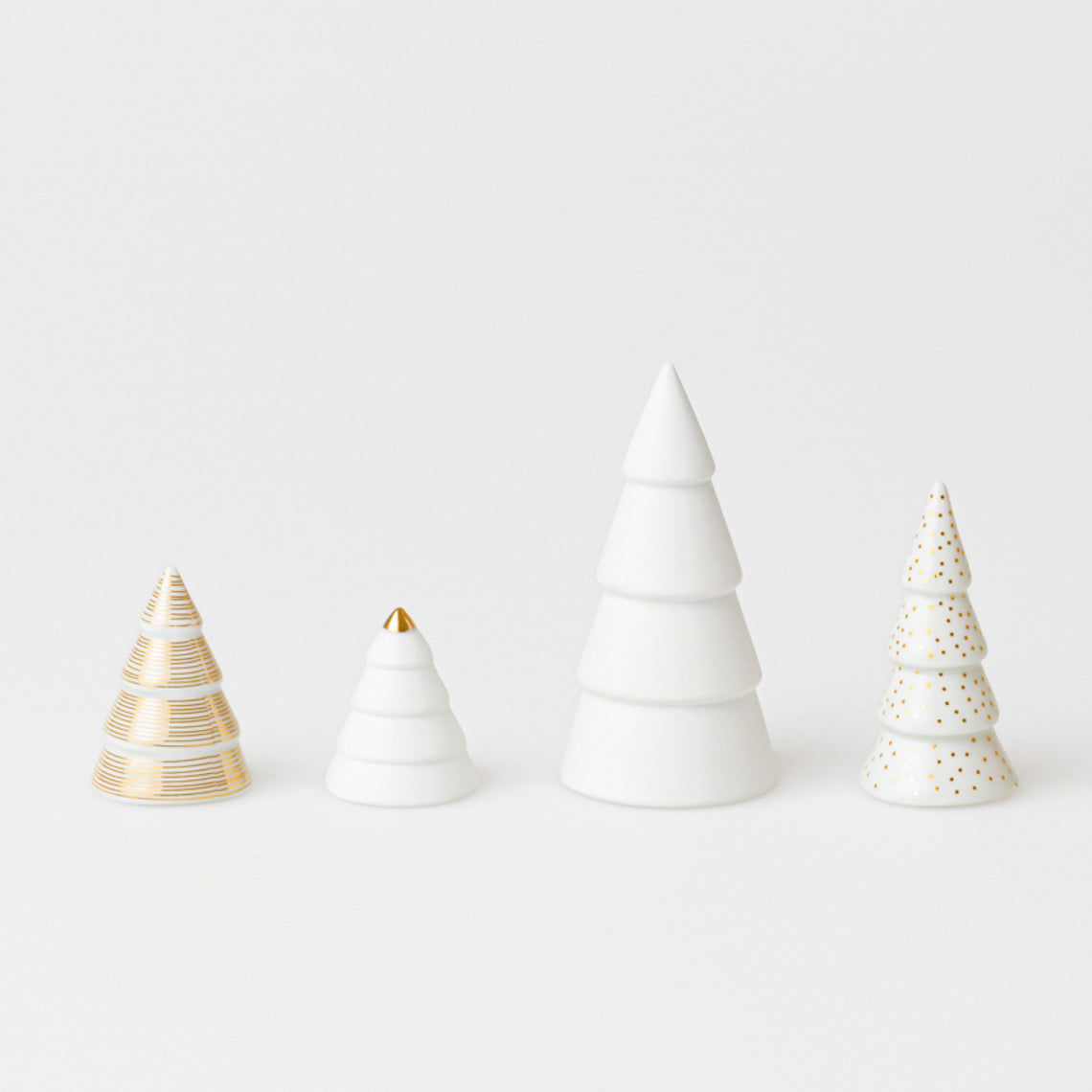 Gold Winter Village Porcelain Fir trees - Set of 4
